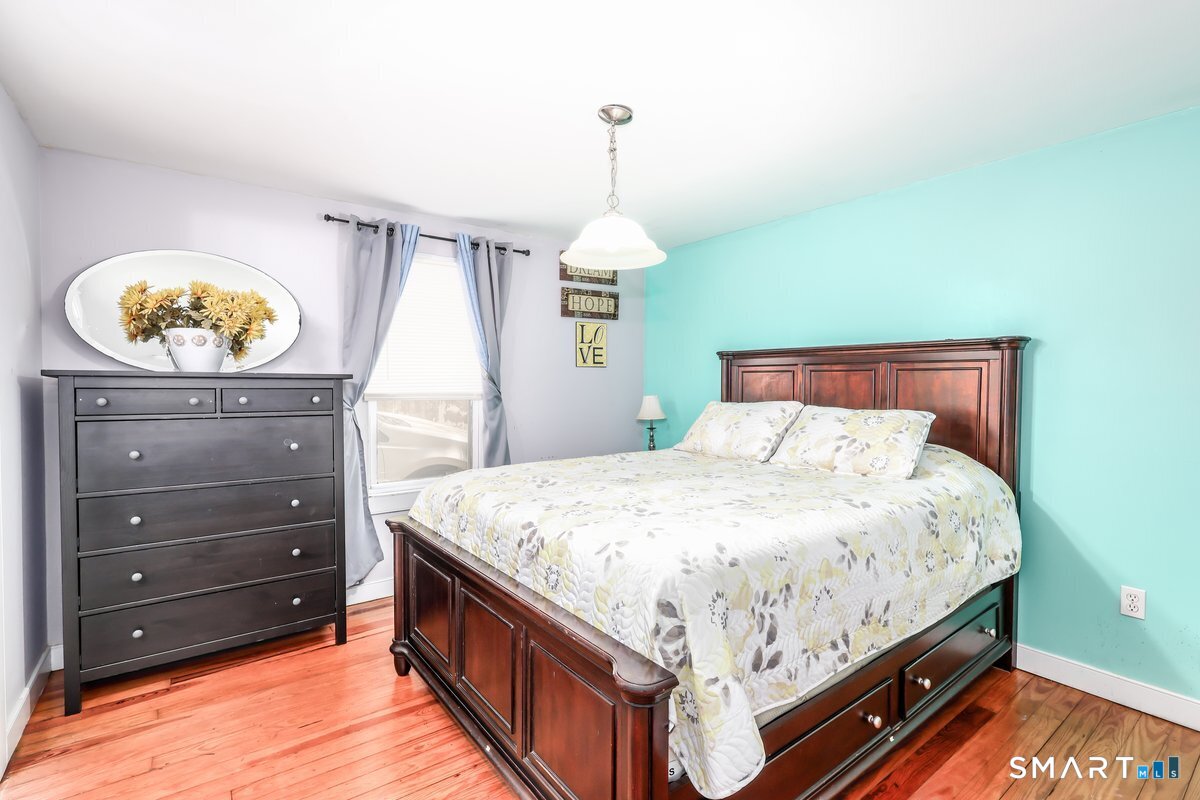 70 Dodgingtown Road Bethel, CT 06801 - Photo 18 of 27 a bedroom with a bed and a dresser