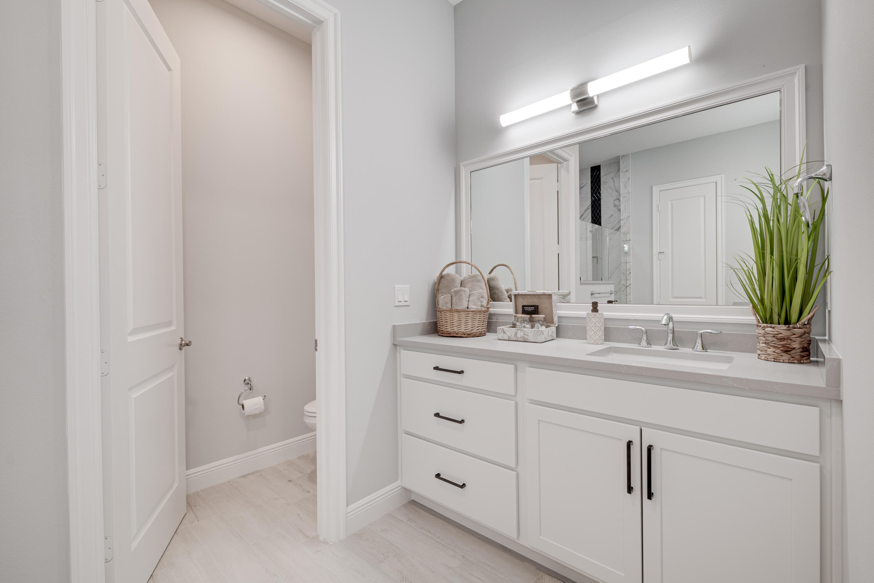 2005 Bridgepointe Circle, Unit 99 Vero Beach, FL 32967 - Photo 18 of 37 a bathroom with a double vanity sink and a mirror