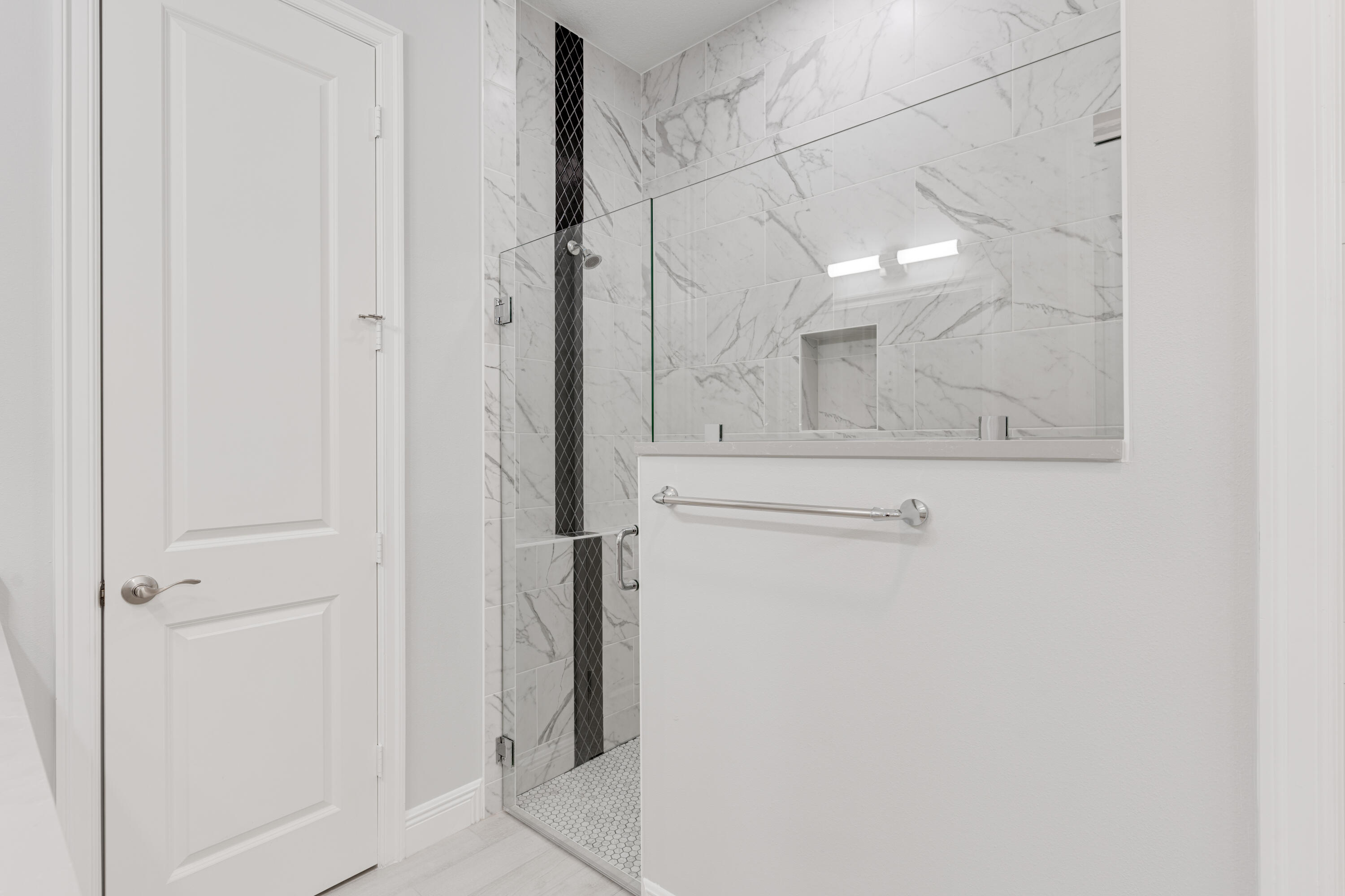 2005 Bridgepointe Circle, Unit 99 Vero Beach, FL 32967 - Photo 22 of 37 a bathroom with a mirror and a shower