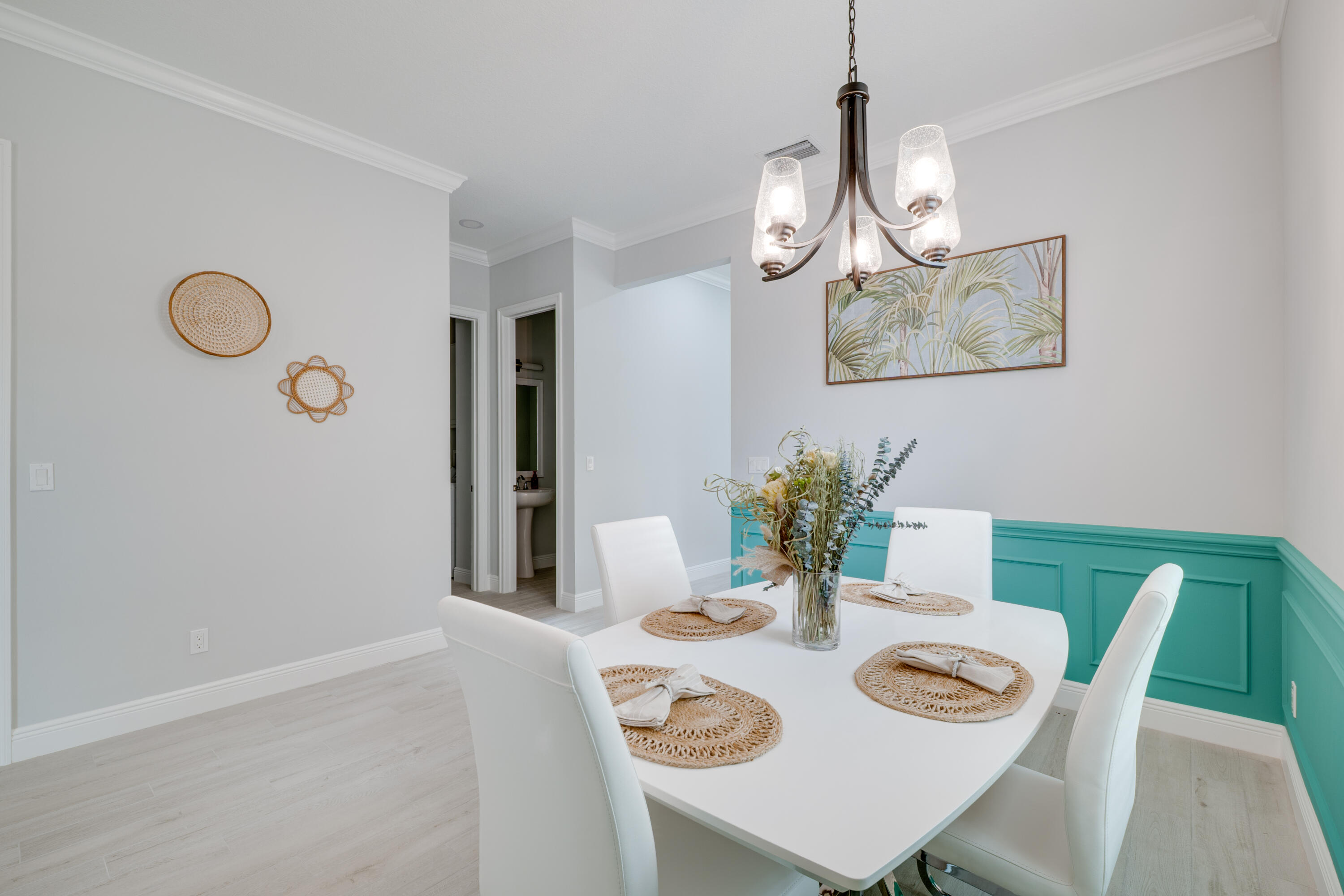 2005 Bridgepointe Circle, Unit 99 Vero Beach, FL 32967 - Photo 3 of 37 a view of a dining room with furniture and wooden floor