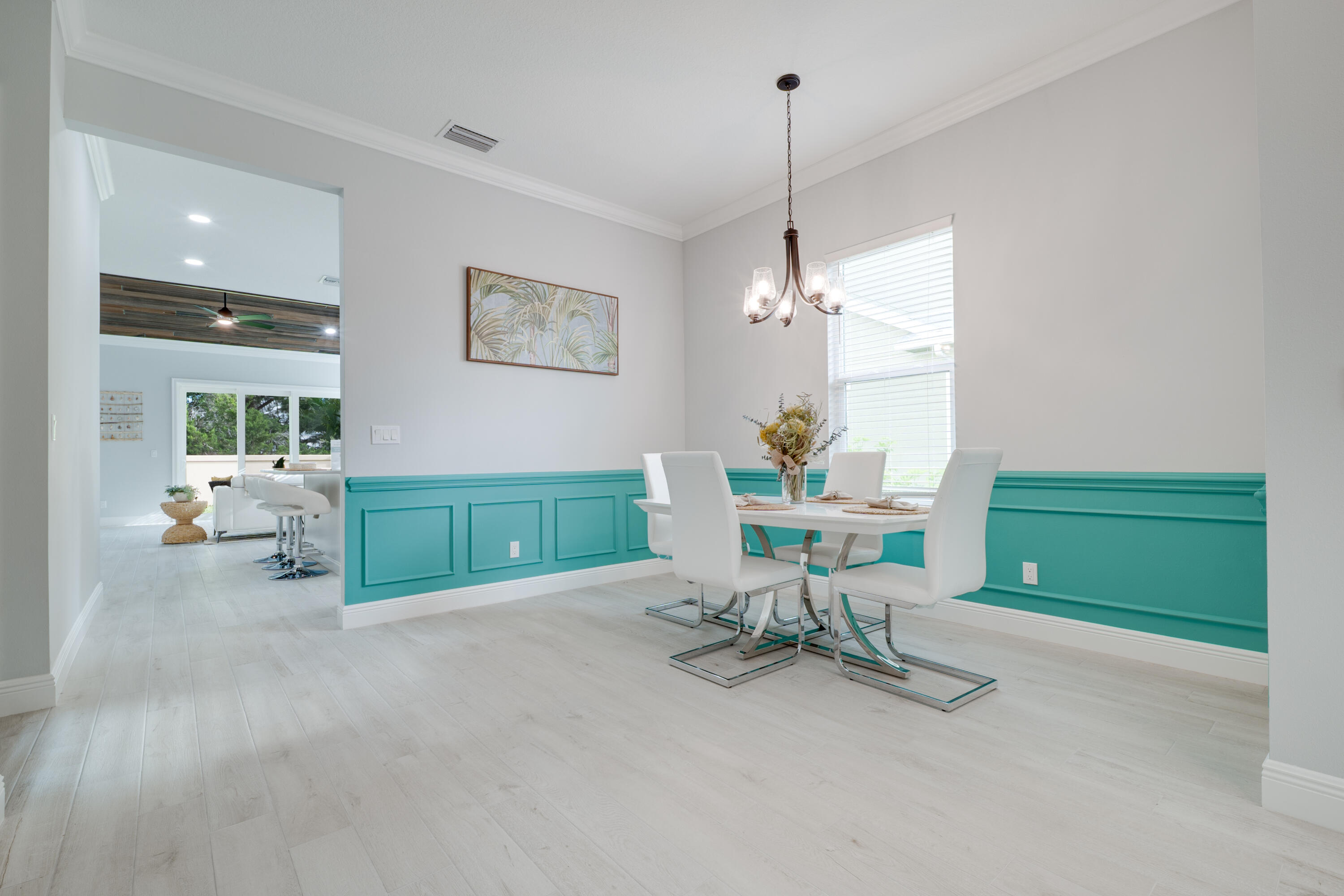 2005 Bridgepointe Circle, Unit 99 Vero Beach, FL 32967 - Photo 4 of 37 a view of a livingroom with furniture and a chandelier