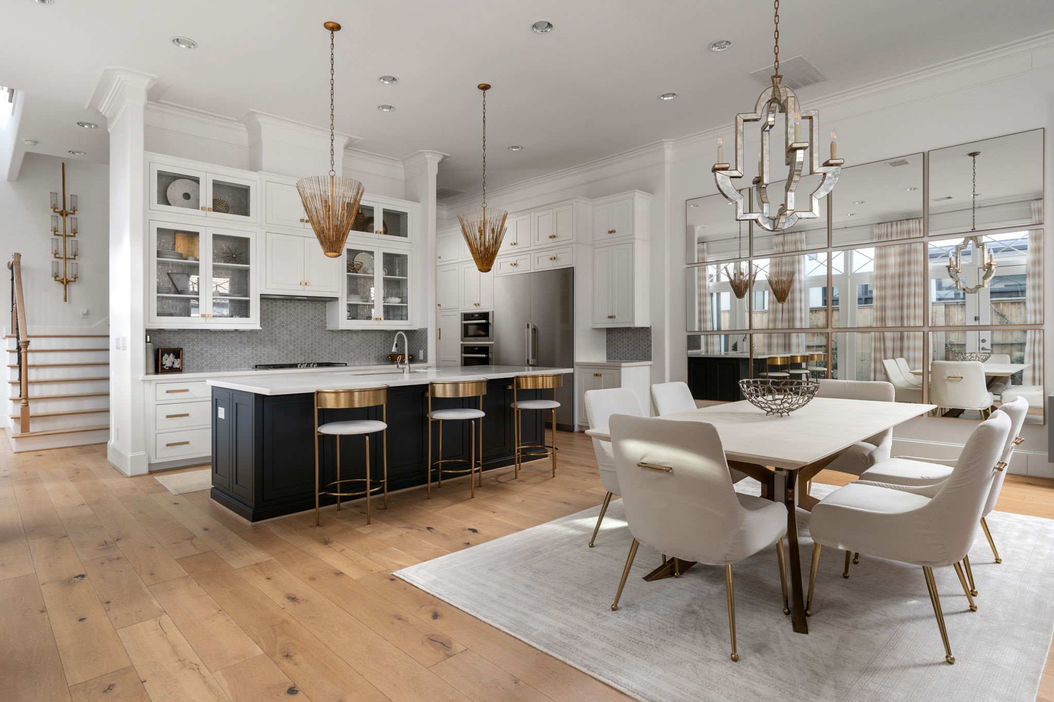 a large kitchen with a table and chairs