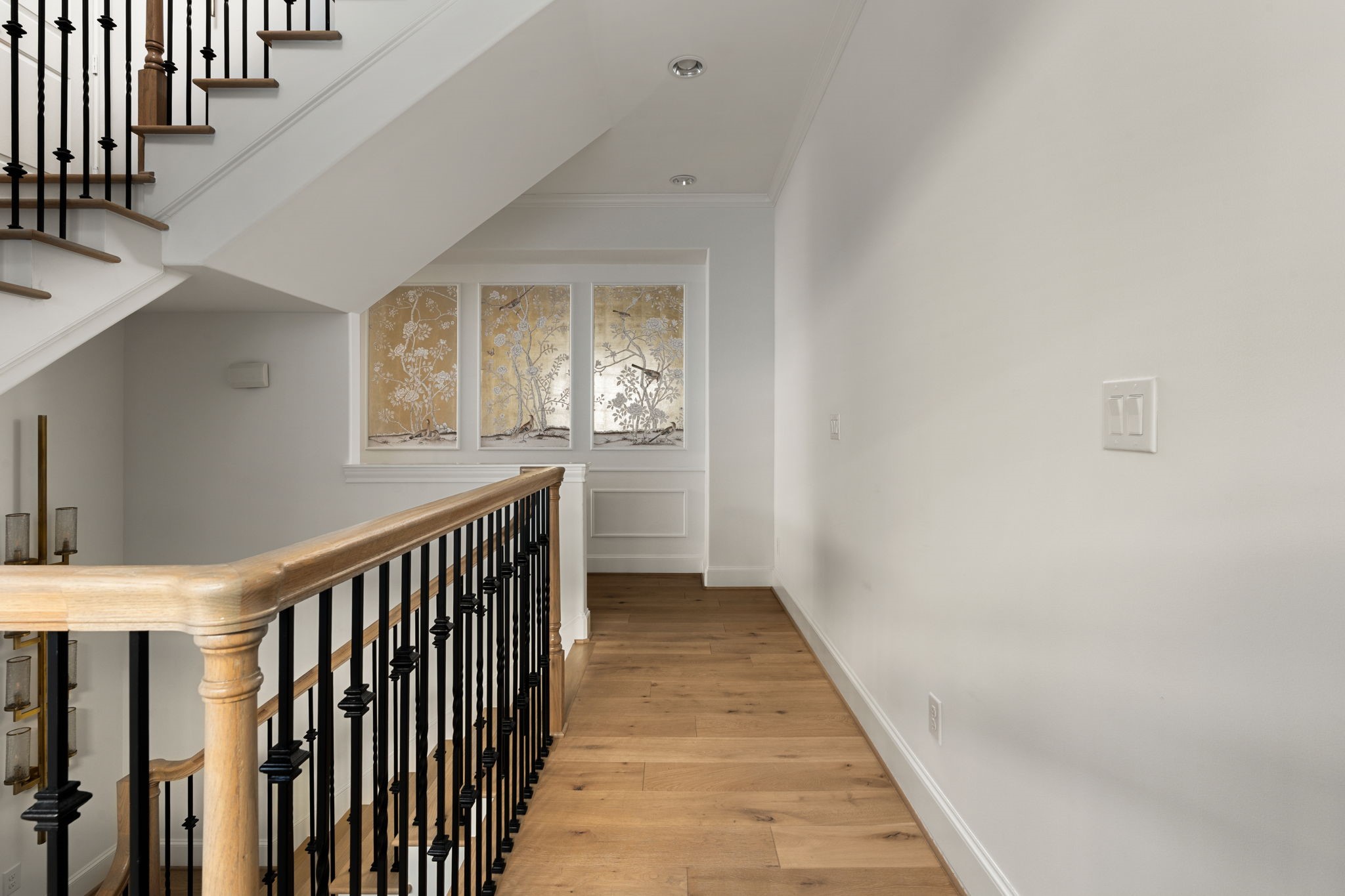 6014 Inwood Drive Houston, TX 77057 - Photo 14 of 33 a view of a hallway with wooden floor and staircase