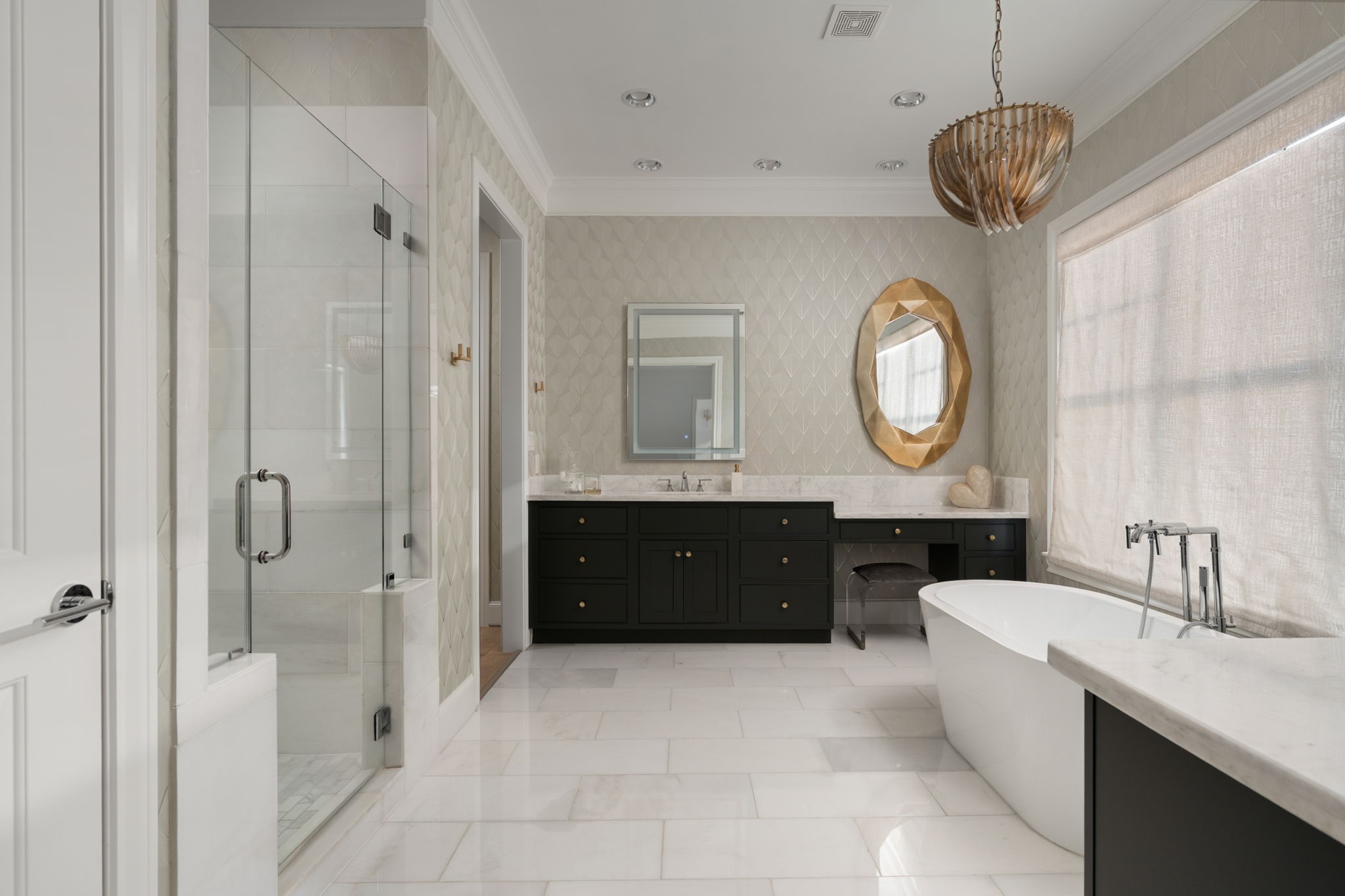 6014 Inwood Drive Houston, TX 77057 - Photo 17 of 33 a bathroom with a double vanity sink and a mirror with shower