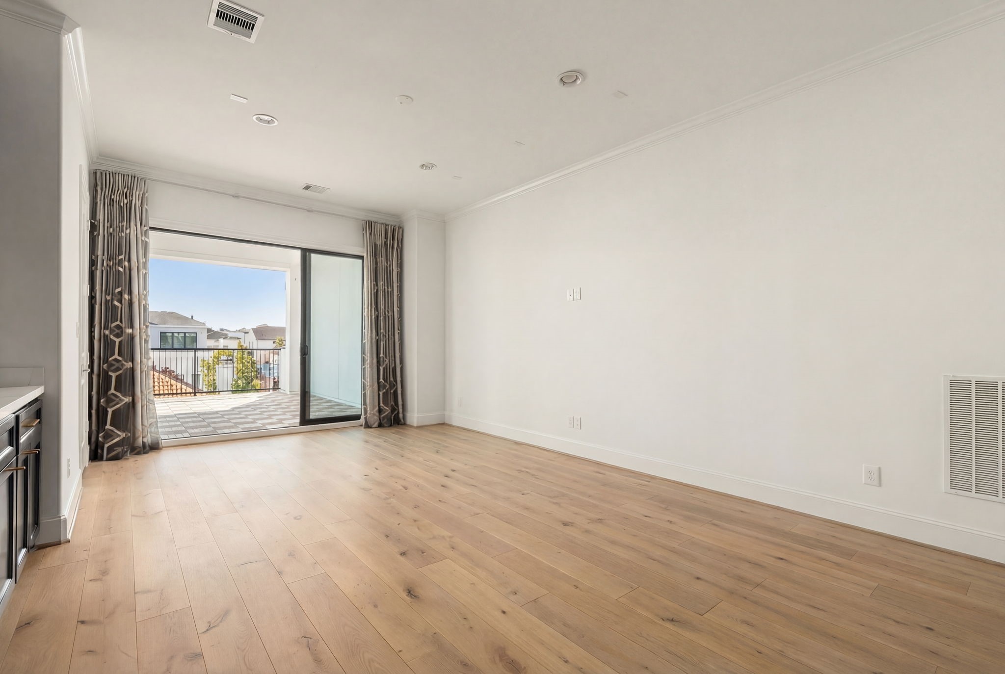 6014 Inwood Drive Houston, TX 77057 - Photo 24 of 33 a view of an empty room with a window and wooden floor