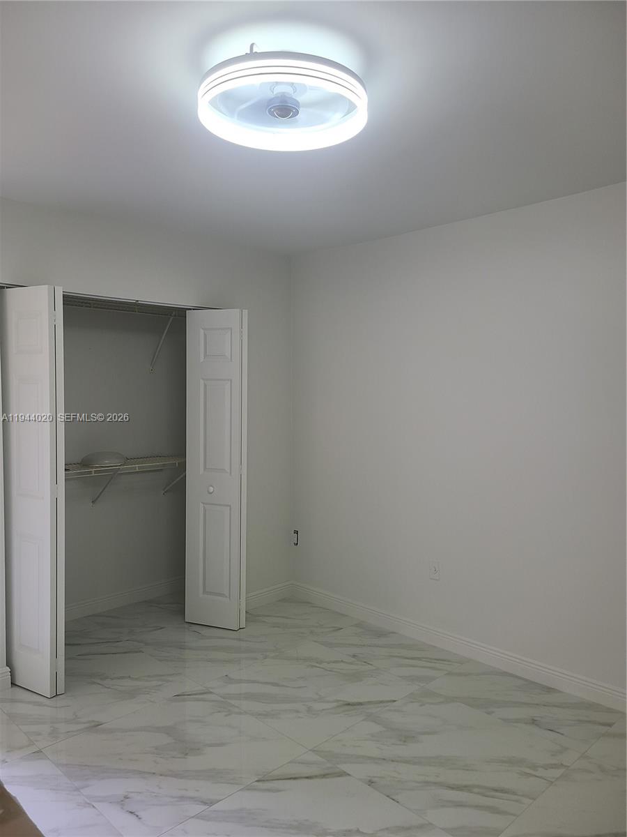 4713 Northwest 7th Street, Unit 1041 Miami, FL 33126 - Photo 5 of 19 a view of an empty room