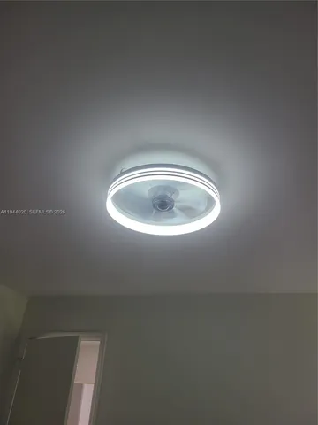 a white toilet sitting next to a shower