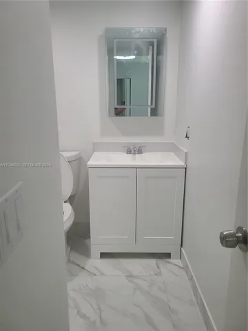 a bathroom with a sink and a toilet