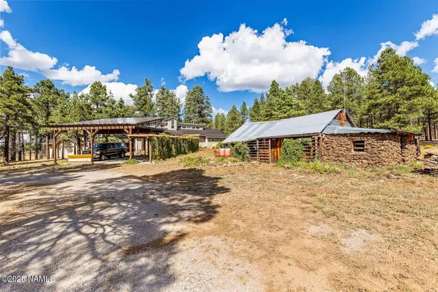 a view of a house with floor to ceiling windows