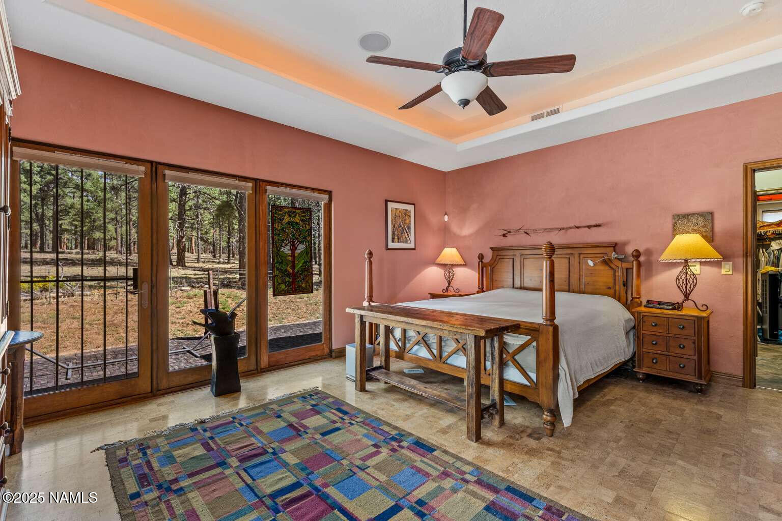 995 North Transwestern Pump Road Bellemont, AZ 86015 - Photo 44 of 81 a bedroom with a bed and wooden floor