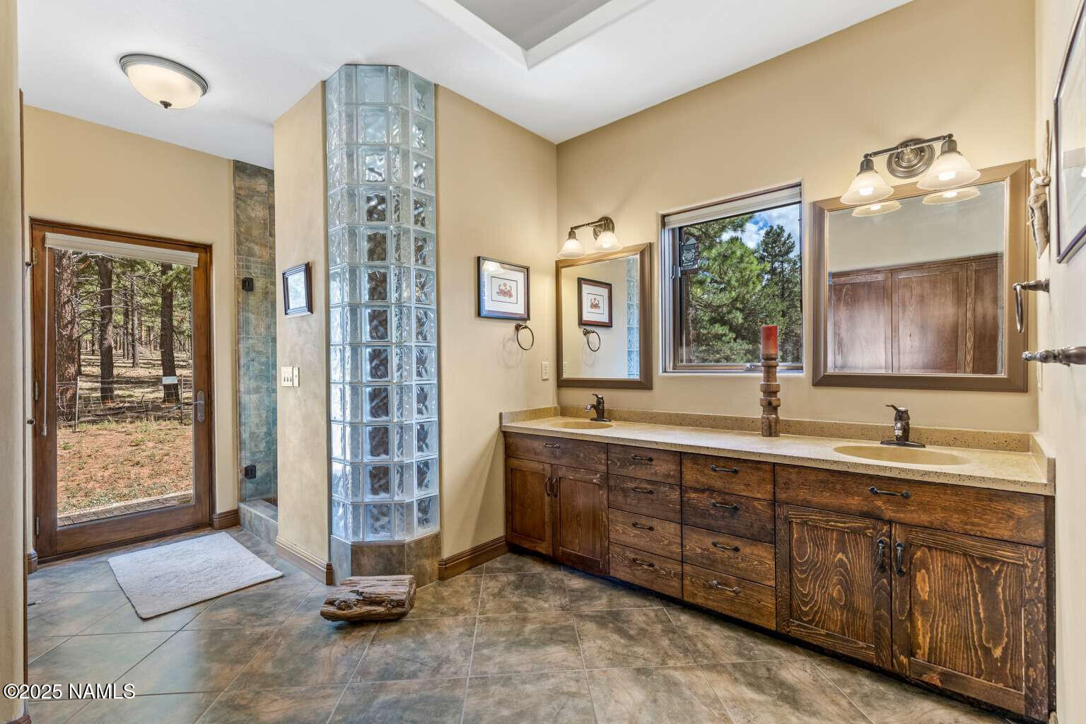 995 North Transwestern Pump Road Bellemont, AZ 86015 - Photo 47 of 81 a spacious bathroom with a double vanity sink a mirror and a shower