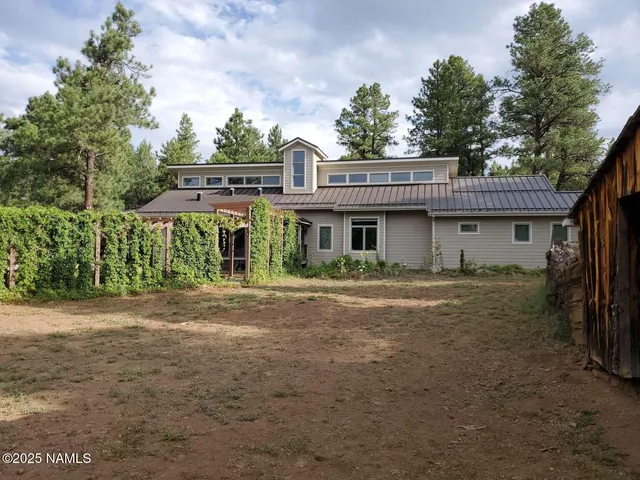 a kitchen with cabinets a sink stainless steel appliances and a counter top space