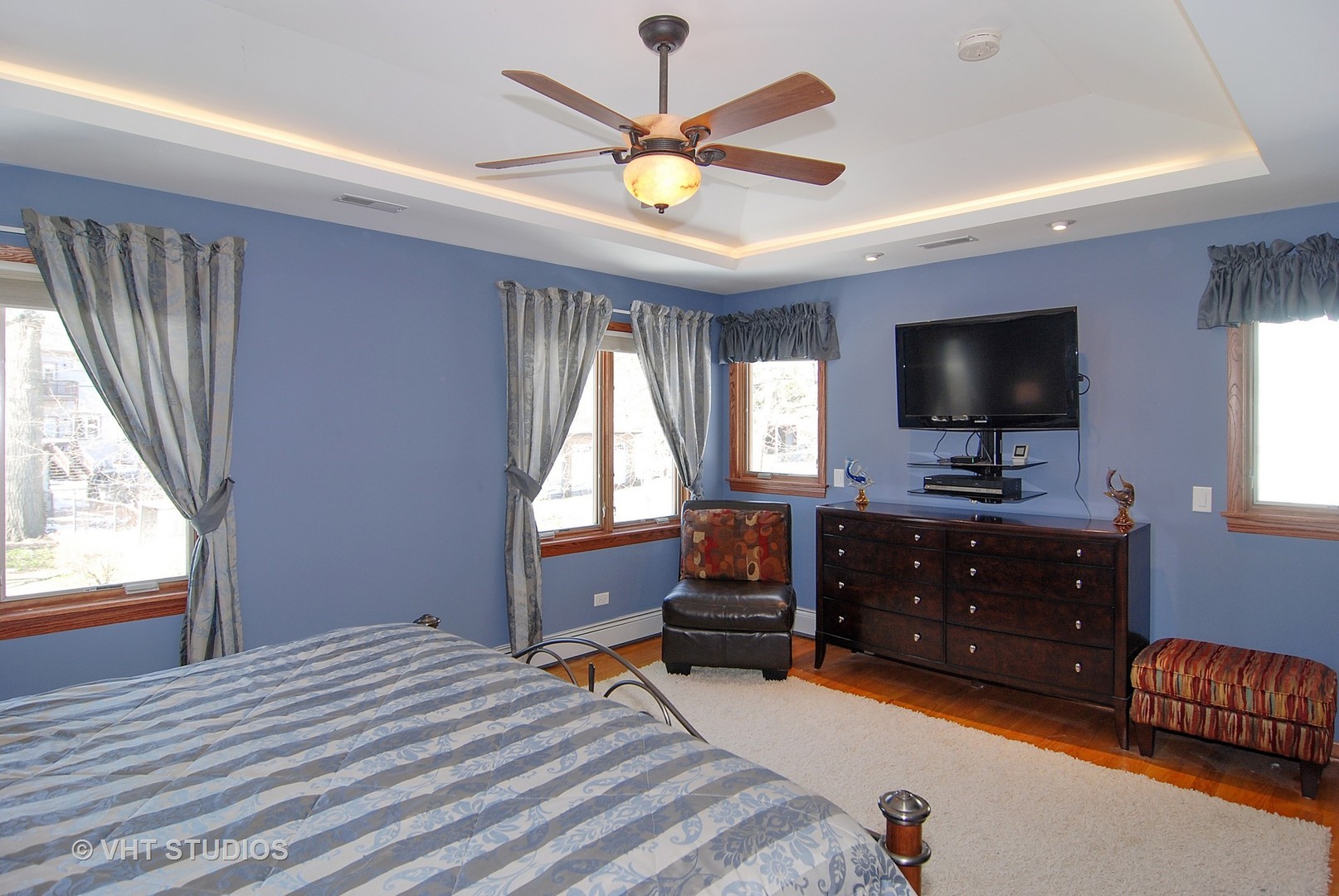 174 Fairbank Road Riverside, IL 60546 - Photo 12 of 31 a bedroom with a bed and a flat screen tv