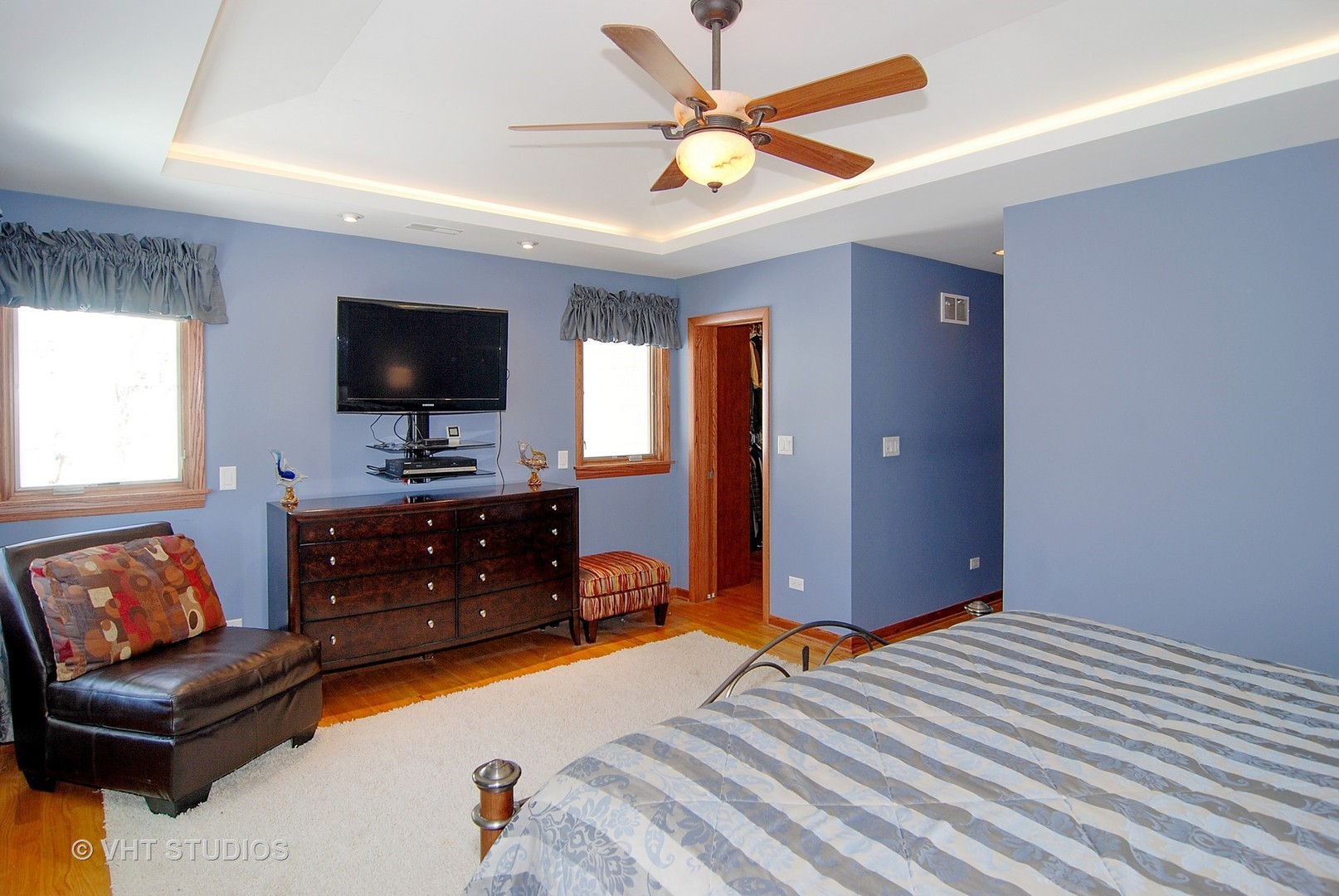 174 Fairbank Road Riverside, IL 60546 - Photo 13 of 31 a bedroom with a bed and a flat screen tv