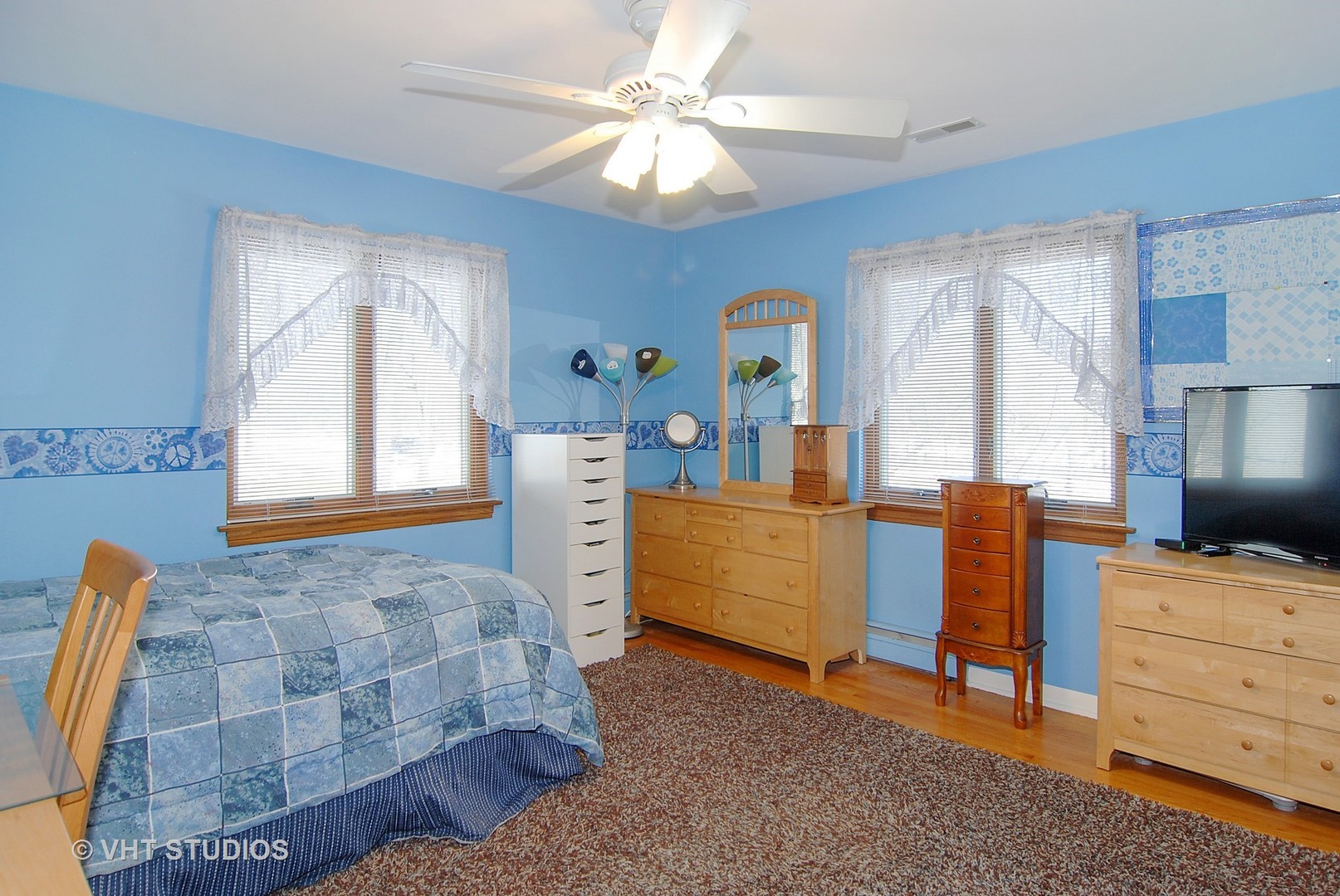 174 Fairbank Road Riverside, IL 60546 - Photo 17 of 31 a bedroom with a bed and a chandelier