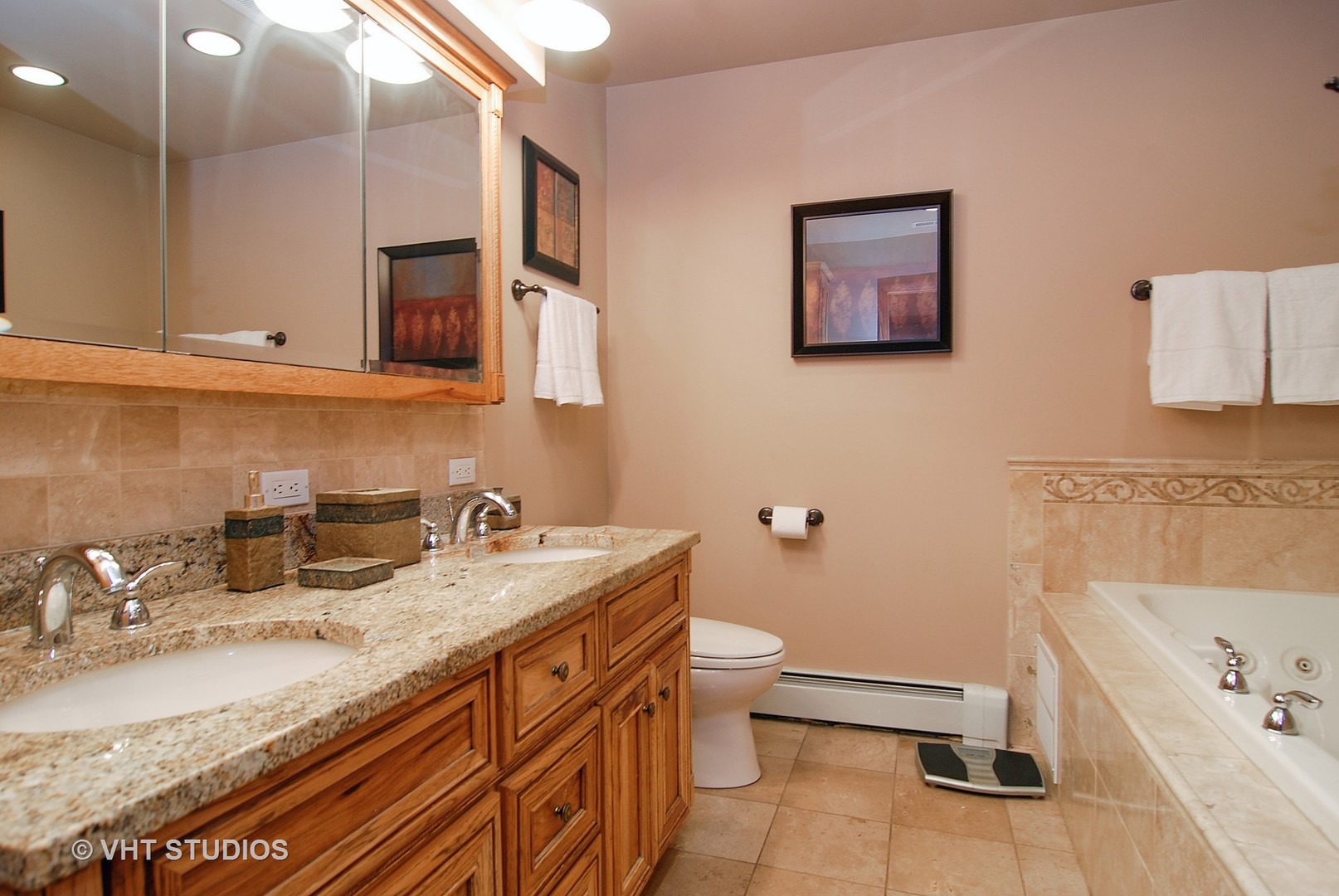 174 Fairbank Road Riverside, IL 60546 - Photo 19 of 31 a bathroom with a granite countertop sink a toilet and mirror
