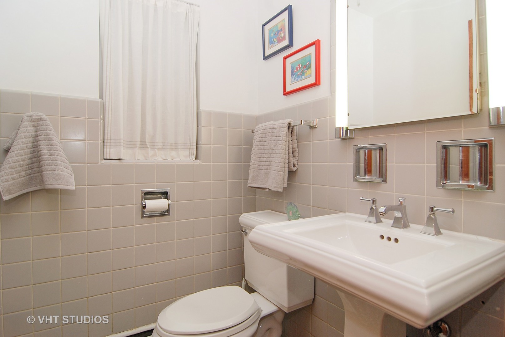 174 Fairbank Road Riverside, IL 60546 - Photo 10 of 31 a bathroom with a sink a toilet and mirror