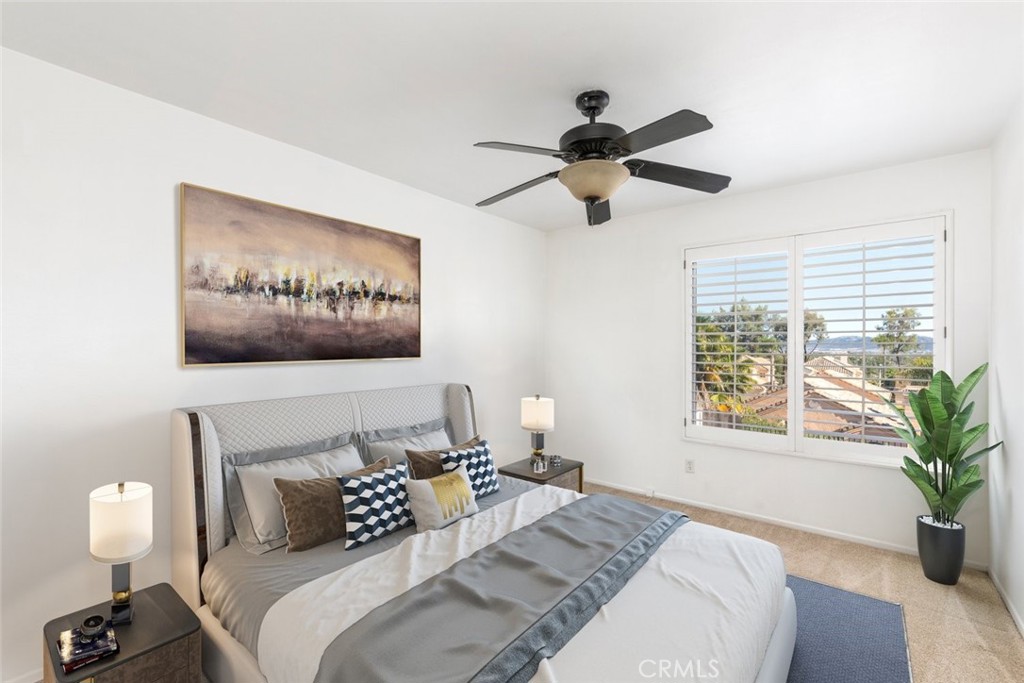 24075 Falconer Drive Murrieta, CA 92562 - Photo 13 of 25 a bedroom with a large bed and a window