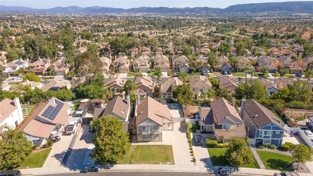 24075 Falconer Drive Murrieta, CA 92562 - Photo 23 of 25 an aerial view of residential houses with outdoor space and trees
