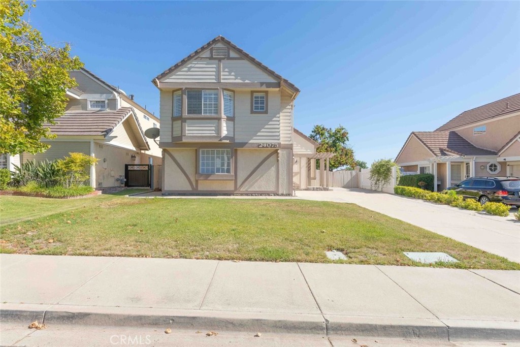 24075 Falconer Drive Murrieta, CA 92562 - Photo 3 of 25 a front view of a house with garden
