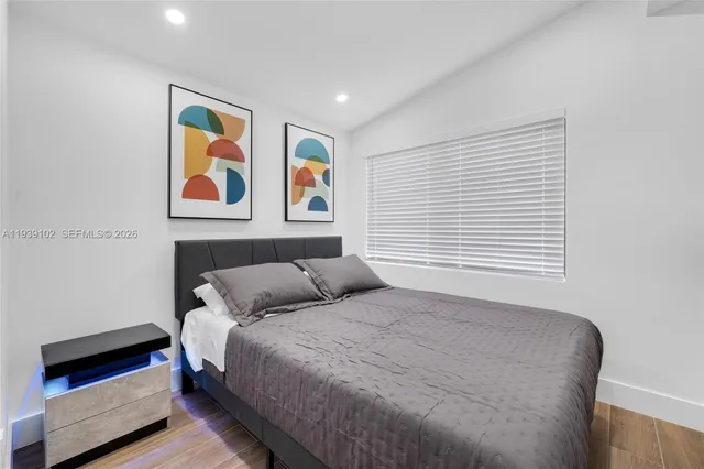 a bedroom with a bed and cupboard