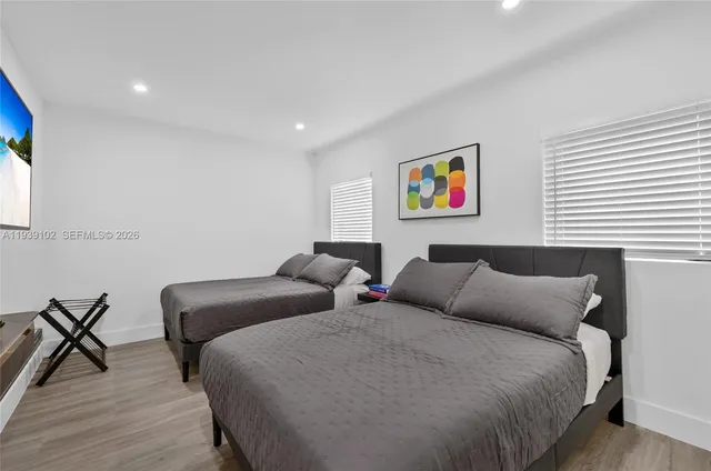 a bedroom with furniture and a window