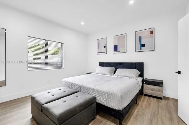 a view of hallway with livingroom and furniture
