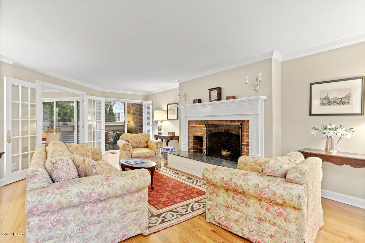 101 Lewis Street, Unit F Greenwich, CT 06830 - Photo 1 of 27 a living room with furniture and a fireplace