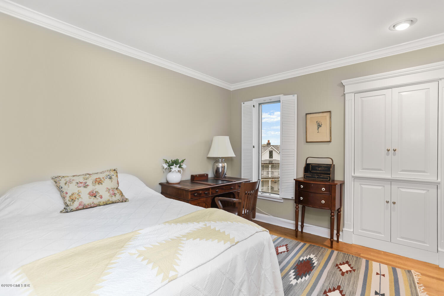 101 Lewis Street, Unit F Greenwich, CT 06830 - Photo 15 of 27 a bedroom with a bed and wooden floor