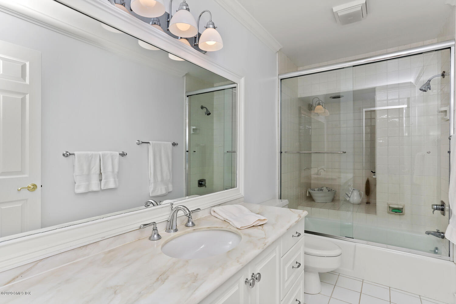 101 Lewis Street, Unit F Greenwich, CT 06830 - Photo 18 of 27 a bathroom with a sink a toilet and shower