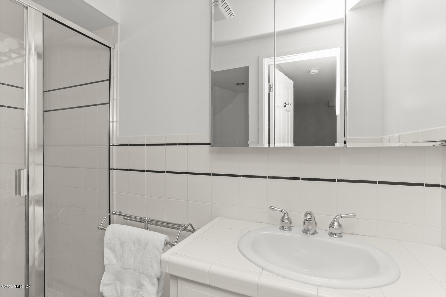 101 Lewis Street, Unit F Greenwich, CT 06830 - Photo 21 of 27 a bathroom with a sink and a mirror