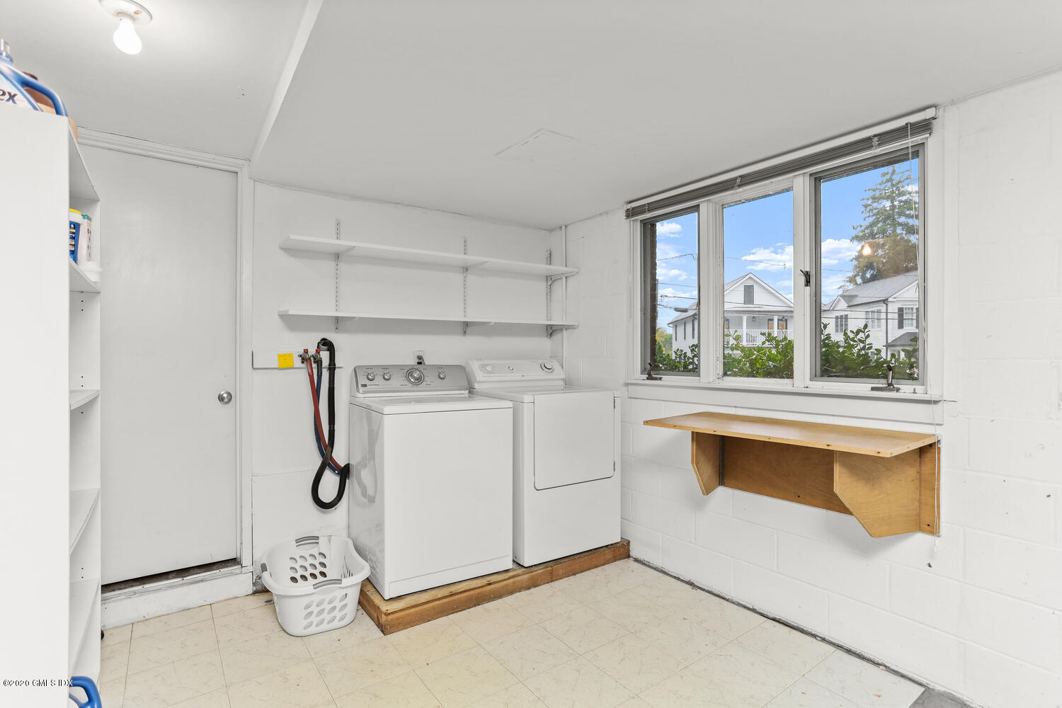 101 Lewis Street, Unit F Greenwich, CT 06830 - Photo 22 of 27 a utility room with dryer and washer