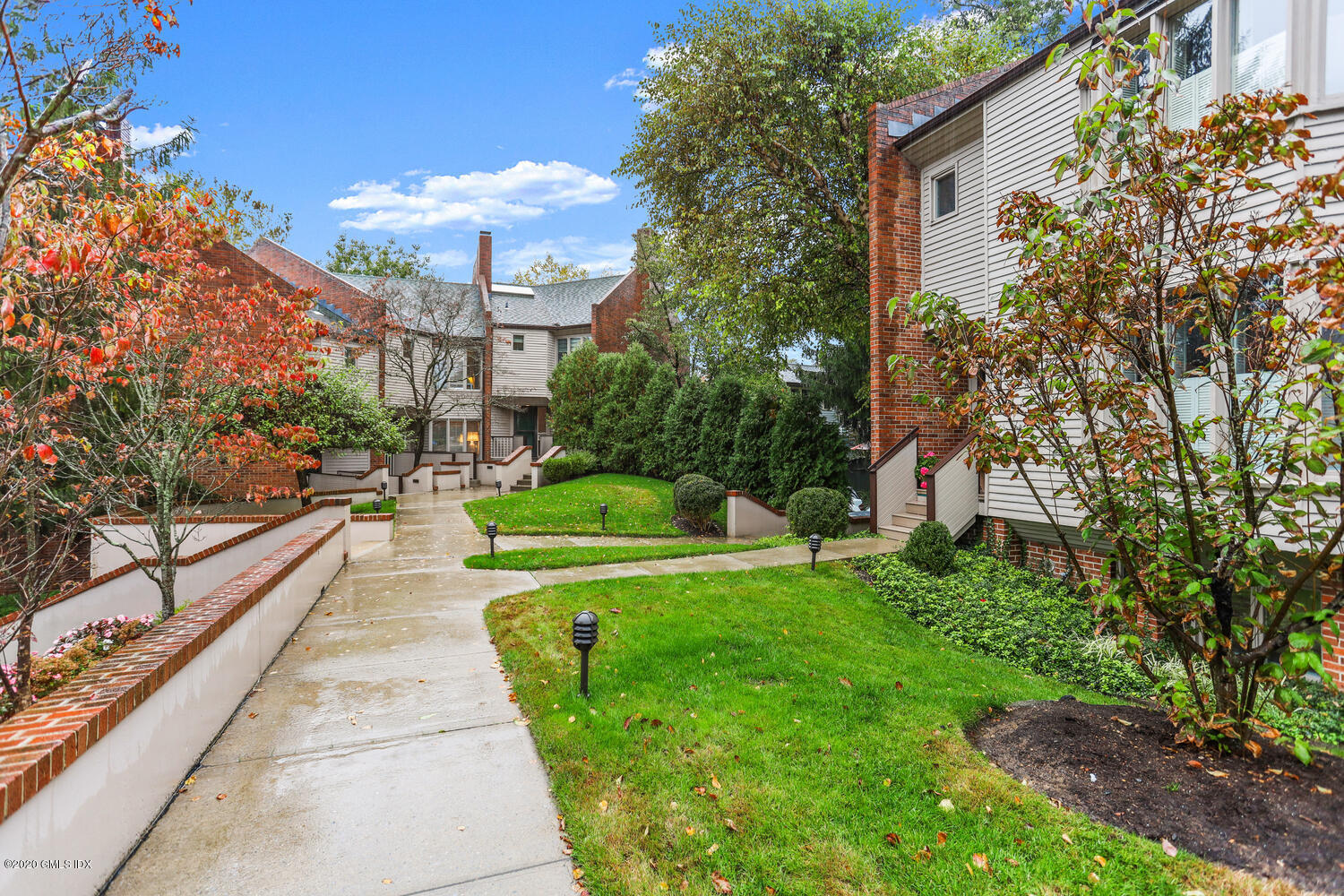 101 Lewis Street, Unit F Greenwich, CT 06830 - Photo 25 of 27 a view of a building with garden