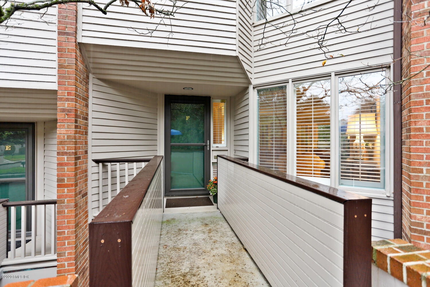 101 Lewis Street, Unit F Greenwich, CT 06830 - Photo 3 of 27 a view of a balcony with wooden floor