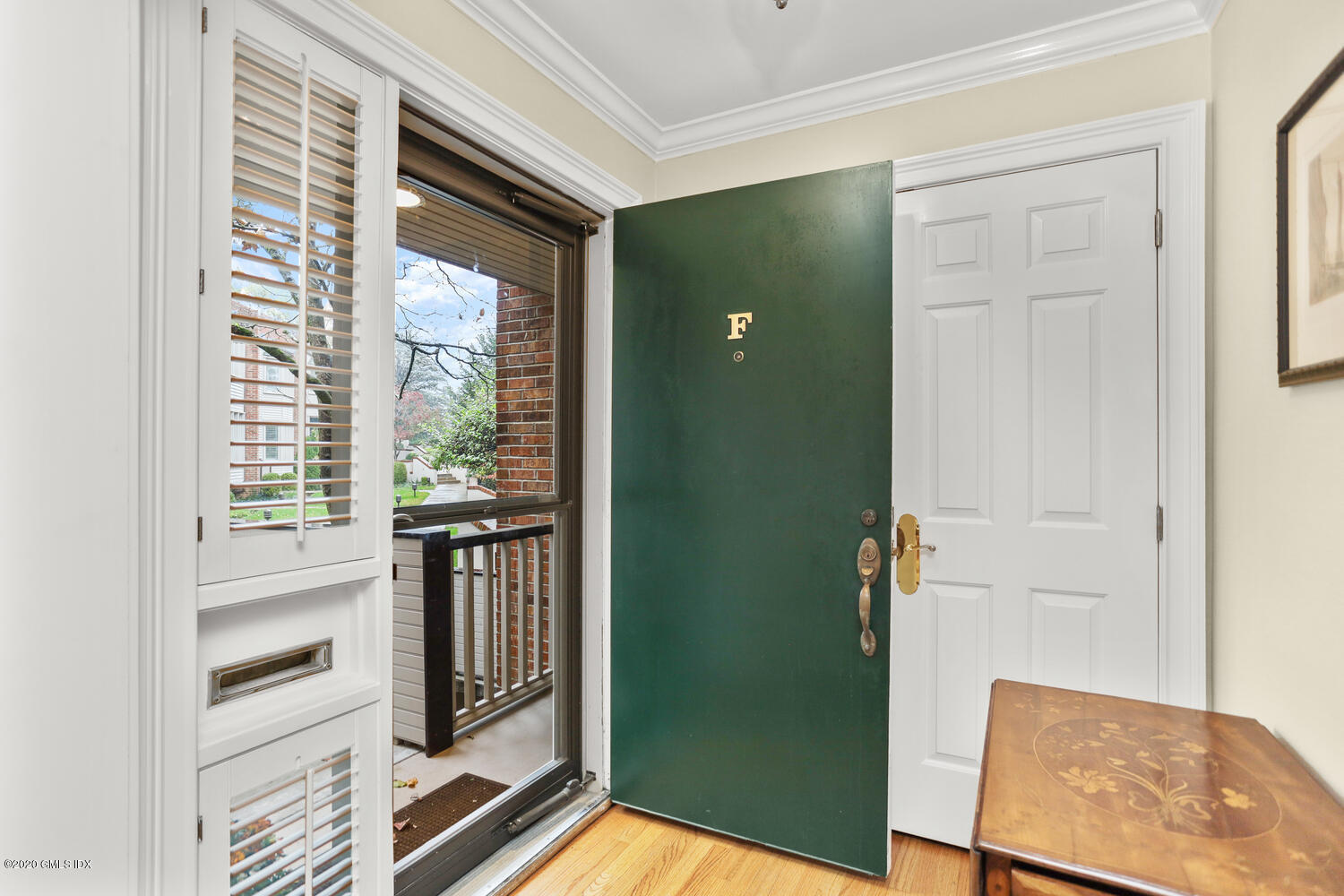 101 Lewis Street, Unit F Greenwich, CT 06830 - Photo 4 of 27 a view of a kitchen from the hallway