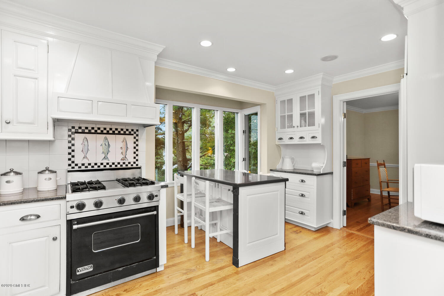 101 Lewis Street, Unit F Greenwich, CT 06830 - Photo 10 of 27 a kitchen with stainless steel appliances a stove refrigerator sink and cabinets