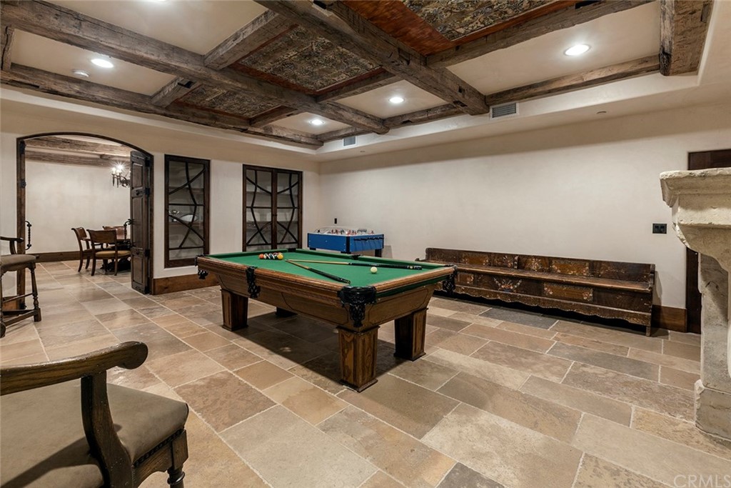 82 Golden Eagle Irvine, CA 92603 - Photo 13 of 40 a living room with furniture gym equipment and a mirror