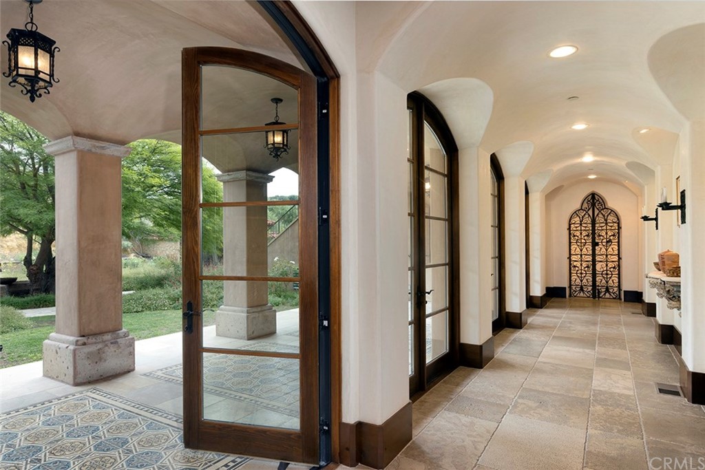 82 Golden Eagle Irvine, CA 92603 - Photo 24 of 40 a view of a hallway with floor to ceiling window and couch