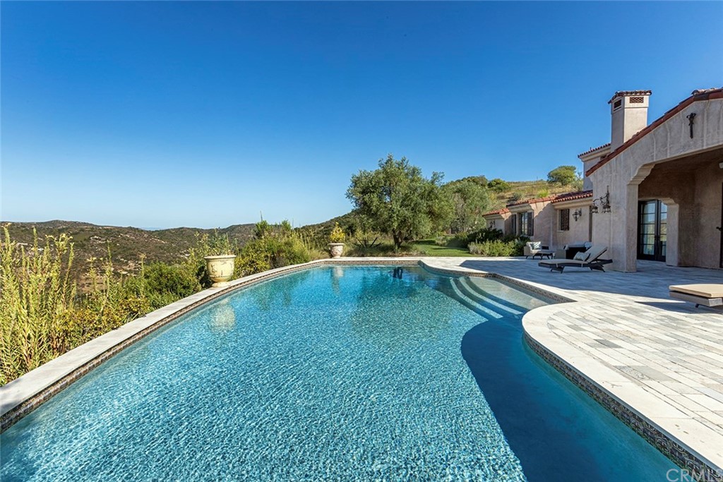 82 Golden Eagle Irvine, CA 92603 - Photo 28 of 40 a view of swimming pool with a yard