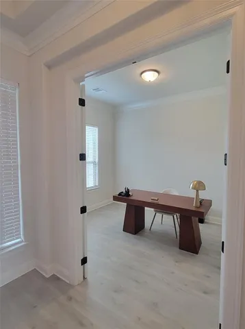 a view of work space with furniture and window