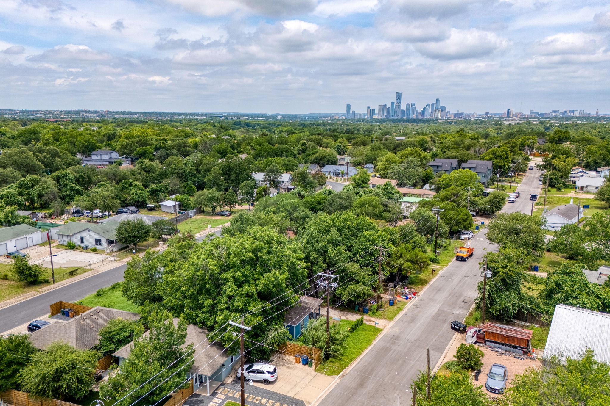 6409 Del Monte Road Austin, TX 78741 - Photo 11 of 15 An aerial perspective reveals a vibrant neighborhood with a distant cityscape on the horizon.