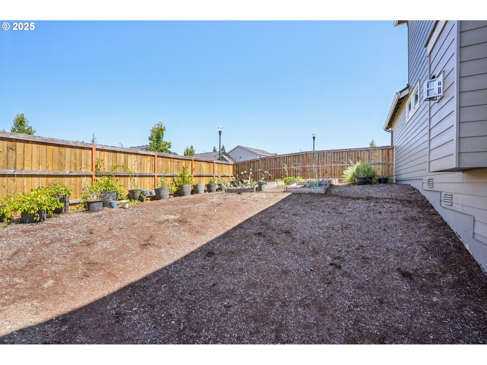 2511 South Coho Place Ridgefield, WA 98642 - Photo 31 of 33 a view of a dry yard with wooden fence