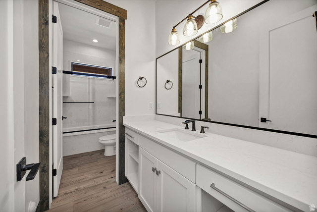 300 Knoll Loop, Unit 227 Fish Haven, ID 83287 - Photo 29 of 56 Full bath with vanity, light wood finished floors, bath / shower combo with glass door, and recessed lighting