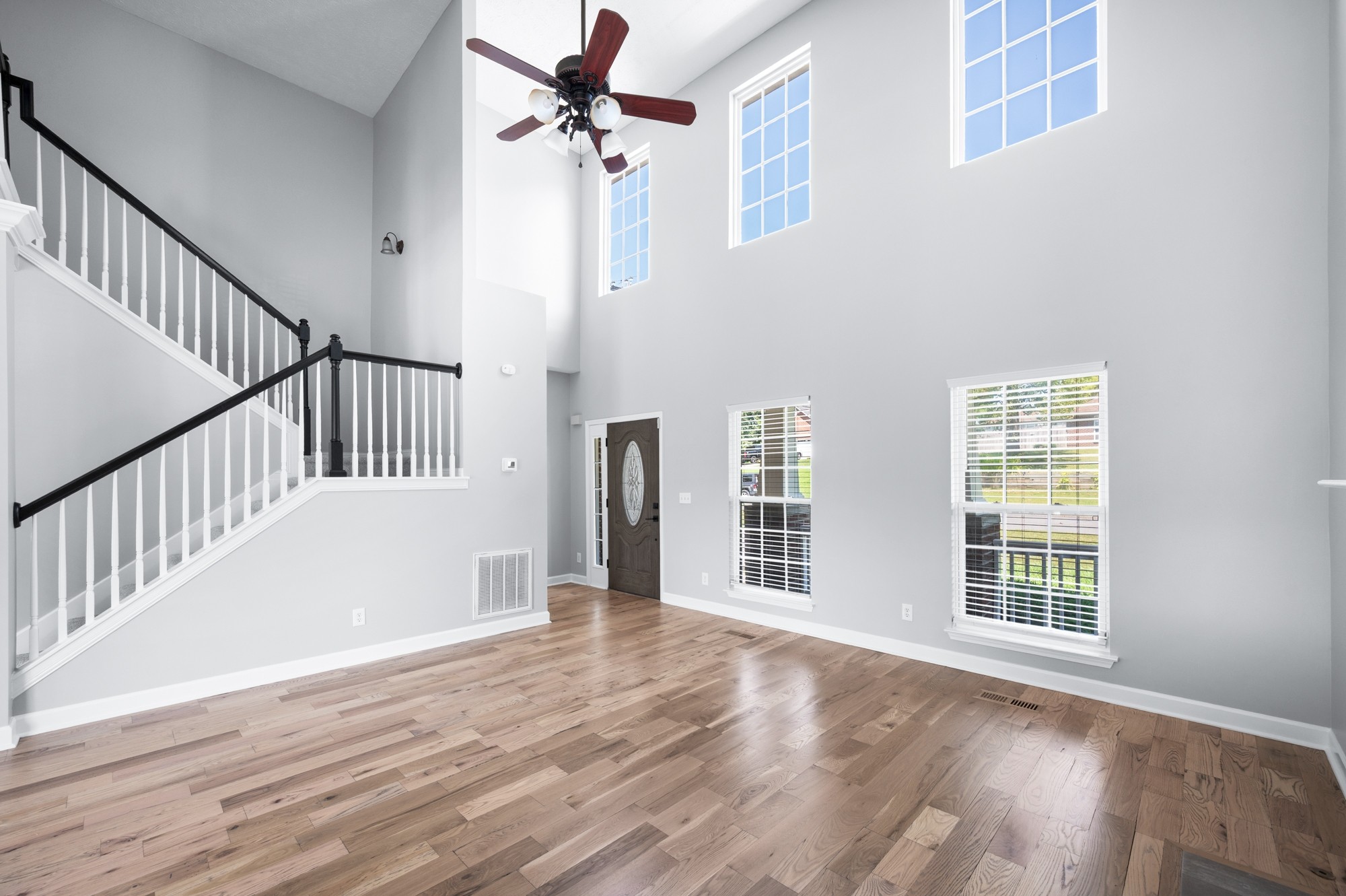 7203 Blue Ridge Drive Fairview, TN 37062 - Photo 13 of 65 a view of an empty room with wooden floor and a window