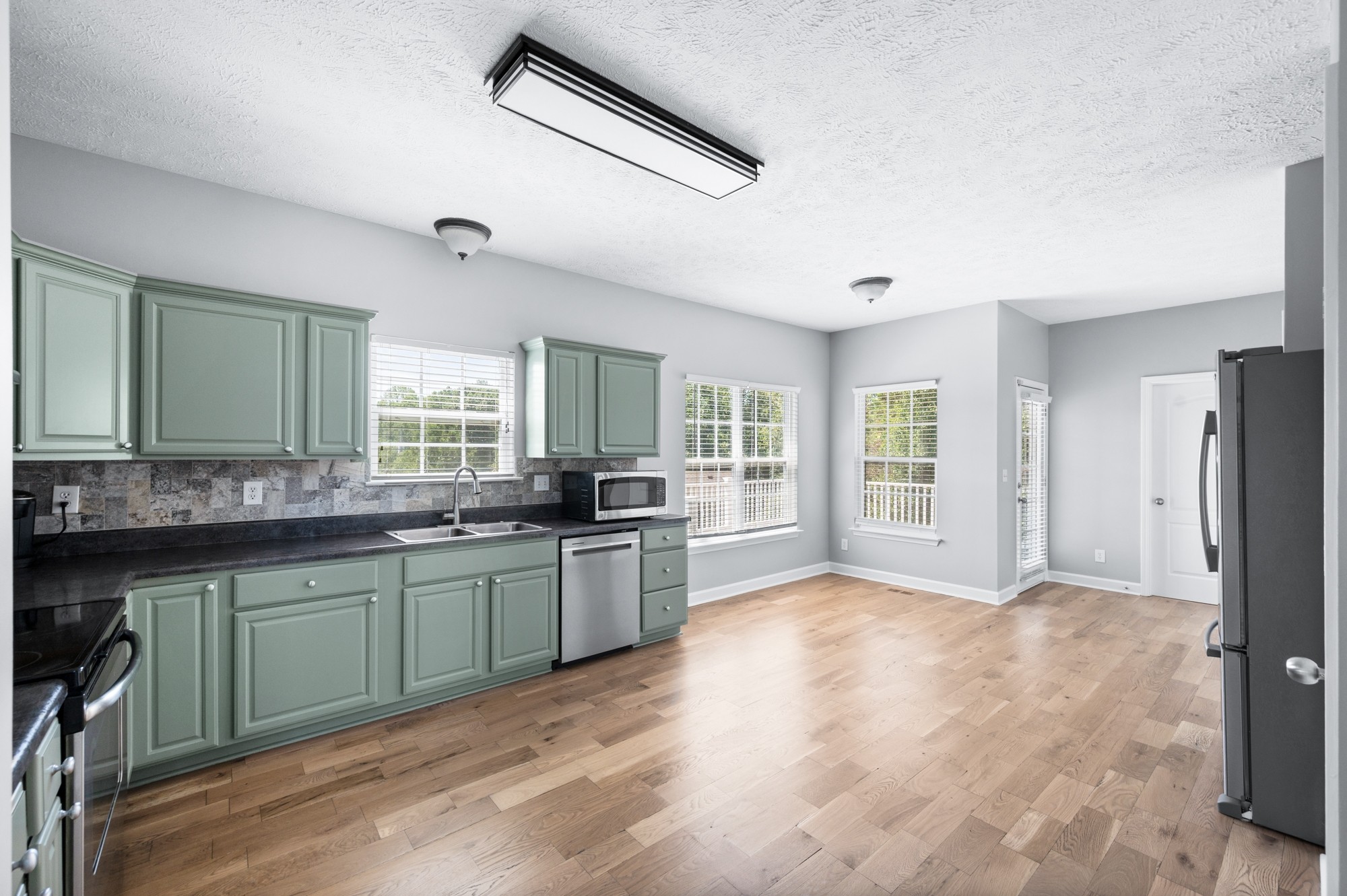 7203 Blue Ridge Drive Fairview, TN 37062 - Photo 18 of 65 a large white kitchen with a large window appliances and cabinets