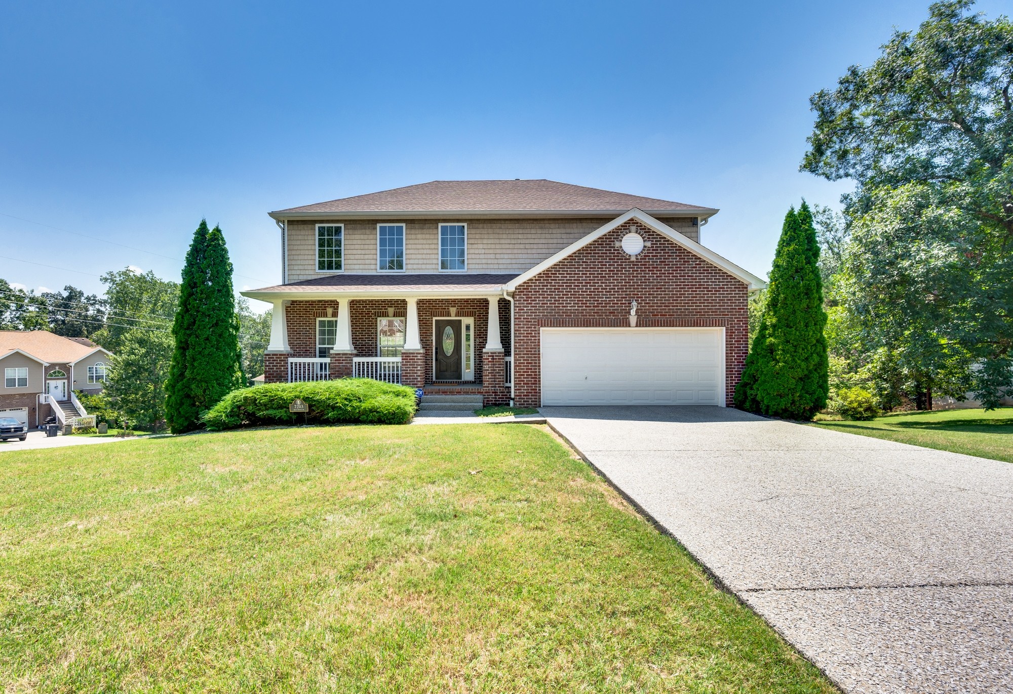 7203 Blue Ridge Drive Fairview, TN 37062 - Photo 2 of 65 a front view of a house with a yard and garage