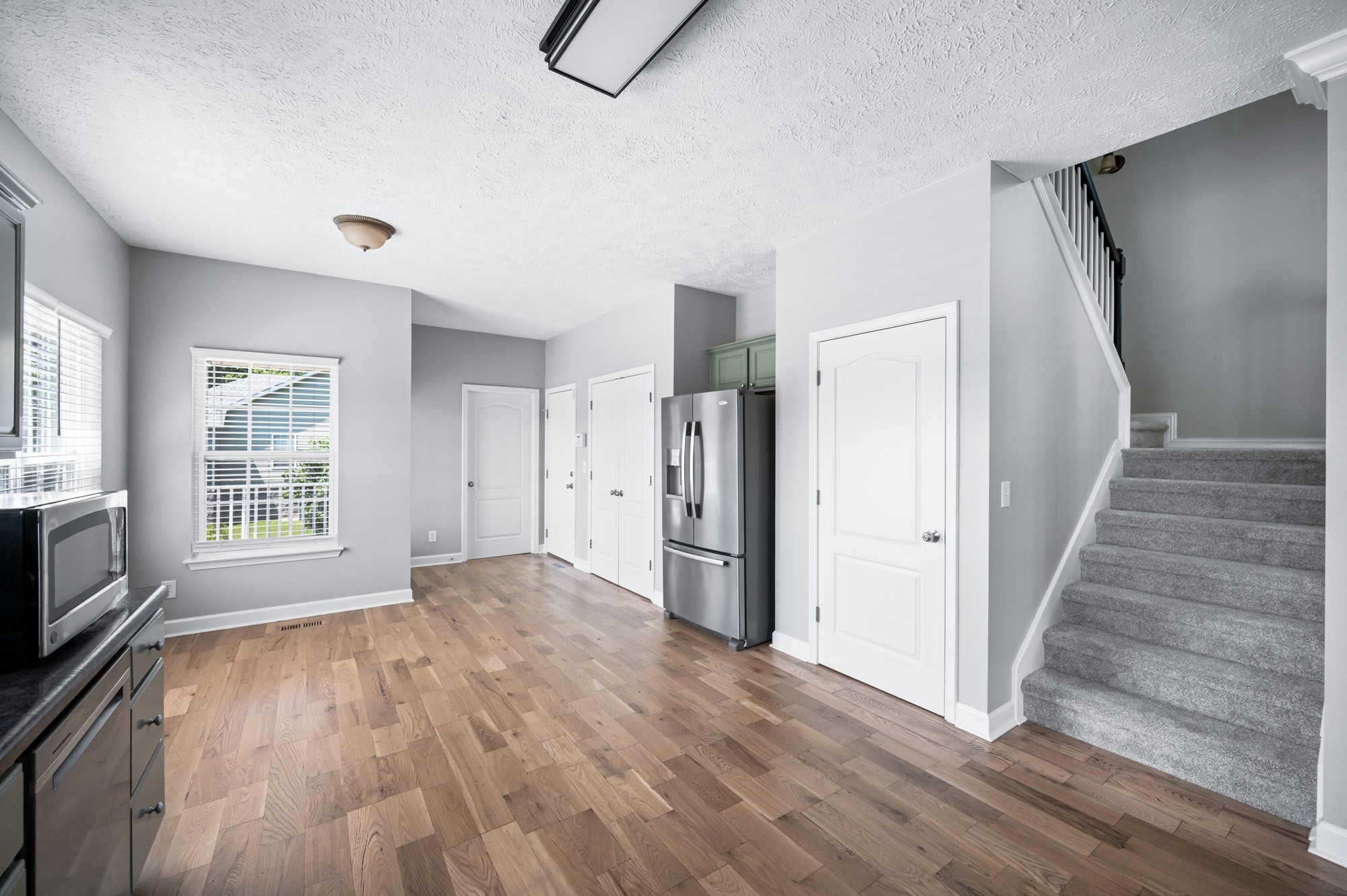 7203 Blue Ridge Drive Fairview, TN 37062 - Photo 21 of 65 a view of empty room with wooden floor and fan