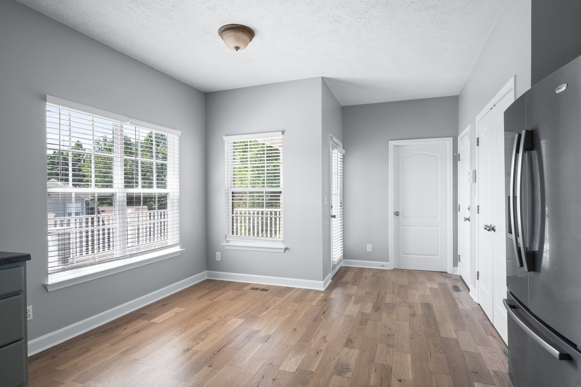 7203 Blue Ridge Drive Fairview, TN 37062 - Photo 22 of 65 an empty room with wooden floor and windows