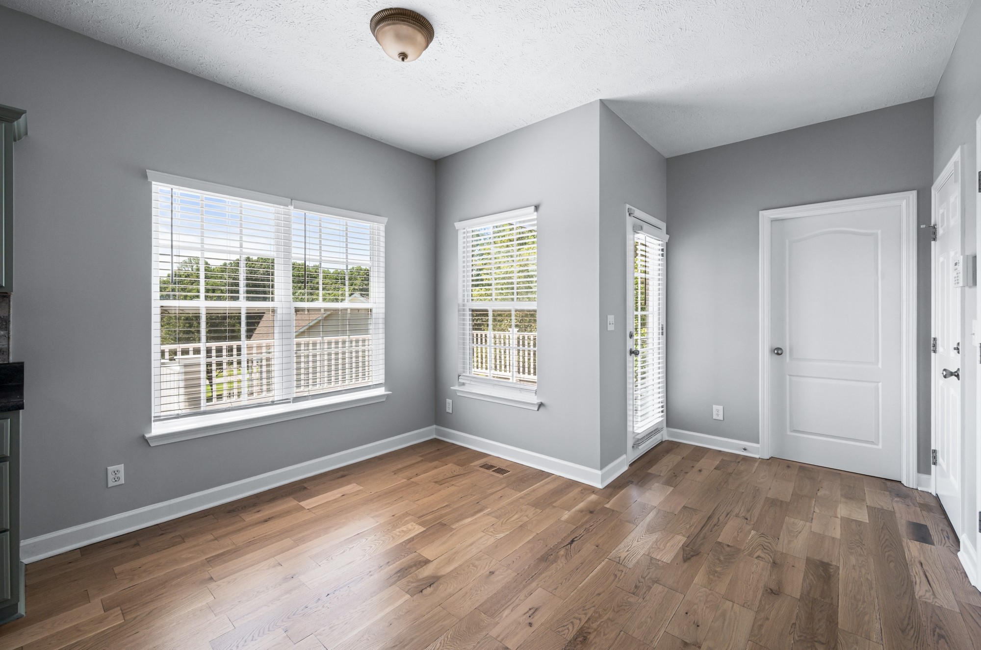 7203 Blue Ridge Drive Fairview, TN 37062 - Photo 23 of 65 an empty room with wooden floor and windows