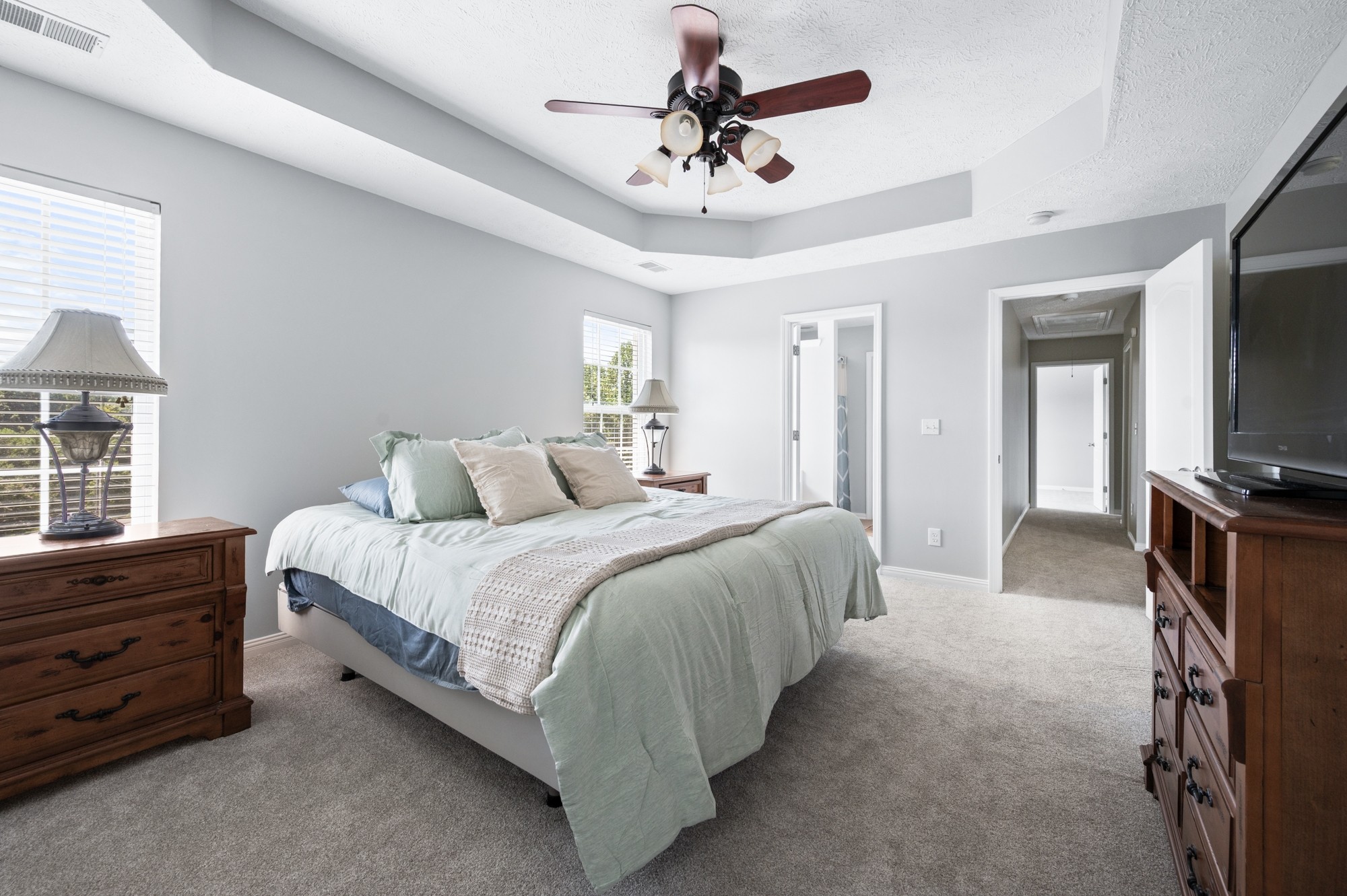 7203 Blue Ridge Drive Fairview, TN 37062 - Photo 29 of 65 a spacious bedroom with a bed and a flat screen tv